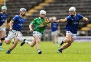 7 June 2025; Conal McGrath of Fermanagh in action against Longford players, from left, Adam Dunsworth  and Sam Elliott during the Electric Ireland Celtic Challenge Corn Michael Feery final match between Longford and Fermanagh at Kingspan Breffni in Cavan. Photo by Thomas Flinkow/Sportsfile