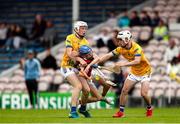 7 June 2025; Ben Geary of Cork White is tackled by Tipperary Gold players Niall Delaney, left, and David Rabbitte during the Electric Ireland Celtic Challenge Corn Michael Hogan final match between Tipperary Gold and Cork White at FBD Semple Stadium in Thurles, Tipperary. Photo by Michael P Ryan/Sportsfile