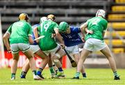 7 June 2025; Evan Lyons of Longford in action against Fermanagh players, from left, Cian Martin and Tiernan Quinn during the Electric Ireland Celtic Challenge Corn Michael Feery final match between Longford and Fermanagh at Kingspan Breffni in Cavan. Photo by Thomas Flinkow/Sportsfile