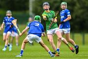 7 June 2025; Cathal Flynn of Meath in action against Conor Hickey of Laois during the Electric Ireland Celtic Challenge Corn William Robinson final match between Meath and Laois at the GAA National Games Development Centre in Abbotstown, Dublin. Photo by Stephen Marken/Sportsfile