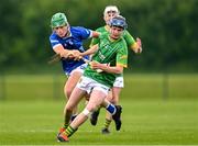 7 June 2025; Cathal Flynn of Meath in action against Ben Meade of Laois during the Electric Ireland Celtic Challenge Corn William Robinson final match between Meath and Laois at the GAA National Games Development Centre in Abbotstown, Dublin. Photo by Stephen Marken/Sportsfile