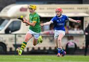 7 June 2025; Alex Cole of Meath in action against Jacob Hillard of Laois during the Electric Ireland Celtic Challenge Corn William Robinson final match between Meath and Laois at the GAA National Games Development Centre in Abbotstown, Dublin. Photo by Stephen Marken/Sportsfile