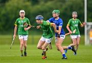 7 June 2025; Cathal Flynn of Meath in action against Ben Meade of Laois during the Electric Ireland Celtic Challenge Corn William Robinson final match between Meath and Laois at the GAA National Games Development Centre in Abbotstown, Dublin. Photo by Stephen Marken/Sportsfile