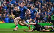 7 June 2025; Jamie Osborne of Leinster evades the tackle of Euan Ferrie of Glasgow Warriors during the United Rugby Championship semi-final match between Leinster and Glasgow Warriors at the Aviva Stadium in Dublin. Photo by Brendan Moran/Sportsfile
