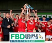 7 June 2025; Cork White joint captains, Josh Brosnan left, and Dave Barry lift the cup after the Electric Ireland Celtic Challenge Corn Michael Hogan final match between Tipperary Gold and Cork White at FBD Semple Stadium in Thurles, Tipperary. Photo by Michael P Ryan/Sportsfile