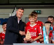 7 June 2025; GAA National Head of Hurling William Maher presents the player of the match to Ben Geary of Cork White after the Electric Ireland Celtic Challenge Corn Michael Hogan final match between Tipperary Gold and Cork White at FBD Semple Stadium in Thurles, Tipperary. Photo by Michael P Ryan/Sportsfile