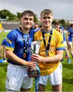 7 June 2025; Longford players Adam Dunsworth, left, and Conor Tiernan celebrate with the cup after the Electric Ireland Celtic Challenge Corn Michael Feery final match between Longford and Fermanagh at Kingspan Breffni in Cavan. Photo by Thomas Flinkow/Sportsfile