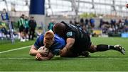 7 June 2025; Ciarán Frawley of Leinster dives over to score his side's sixth try despite the attention of Sam Talakai of Glasgow Warriors during the United Rugby Championship semi-final match between Leinster and Glasgow Warriors at the Aviva Stadium in Dublin. Photo by Brendan Moran/Sportsfile
