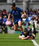 7 June 2025; James Lowe of Leinster evades the tackle of Max Williamson of Glasgow Warriors during the United Rugby Championship semi-final match between Leinster and Glasgow Warriors at the Aviva Stadium in Dublin. Photo by Seb Daly/Sportsfile