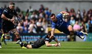 7 June 2025; Rónan Kelleher of Leinster is tackled by Jamie Dobie of Glasgow Warriors during the United Rugby Championship semi-final match between Leinster and Glasgow Warriors at the Aviva Stadium in Dublin. Photo by Seb Daly/Sportsfile