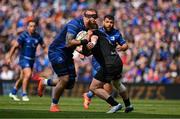 7 June 2025; RG Snyman of Leinster is tackled by Kyle Rowe of Glasgow Warriors during the United Rugby Championship semi-final match between Leinster and Glasgow Warriors at the Aviva Stadium in Dublin. Photo by Brendan Moran/Sportsfile
