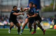 7 June 2025; Scott Penny of Leinster is tackled by Sione Tuipulotu and Macenzzie Duncan of Glasgow Warriors during the United Rugby Championship semi-final match between Leinster and Glasgow Warriors at the Aviva Stadium in Dublin. Photo by Brendan Moran/Sportsfile