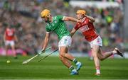 7 June 2025; Tom Morrissey of Limerick in action against Shane Barrett of Cork during the Munster GAA Hurling Senior Championship final match between Limerick and Cork at LIT Gaelic Grounds in Limerick. Photo by John Sheridan/Sportsfile