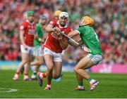 7 June 2025; Tim O'Mahony of Cork in action against Adam English of Limerick during the Munster GAA Hurling Senior Championship final match between Limerick and Cork at LIT Gaelic Grounds in Limerick. Photo by John Sheridan/Sportsfile