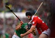 7 June 2025; Aidan O'Connor of Limerick is tackled by Eoin Downey of Cork during the Munster GAA Hurling Senior Championship final match between Limerick and Cork at LIT Gaelic Grounds in Limerick. Photo by Ray McManus/Sportsfile