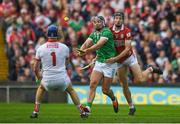 7 June 2025; Aidan O'Connor of Limerick shoots to score his side's first goal despite the efforts of Eoin Downey of Cork during the Munster GAA Hurling Senior Championship final match between Limerick and Cork at LIT Gaelic Grounds in Limerick. Photo by John Sheridan/Sportsfile