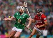 7 June 2025; Cian Lynch of Limerick is tackled by Mark Coleman of Cork during the Munster GAA Hurling Senior Championship final match between Limerick and Cork at TUS Gaelic Grounds in Limerick. Photo by Ray McManus/Sportsfile