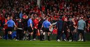 7 June 2025; Cork and Limerick officials are seperated as the referee Thomas Walsh makes his way off the field at half time during the Munster GAA Hurling Senior Championship final match between Limerick and Cork at TUS Gaelic Grounds in Limerick. Photo by Ray McManus/Sportsfile