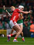 7 June 2025; Tim O'Mahony of Cork is tackled by Adam English of Limerick during the Munster GAA Hurling Senior Championship final match between Limerick and Cork at TUS Gaelic Grounds in Limerick. Photo by Ray McManus/Sportsfile