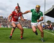 7 June 2025; Dan Morrissey of Limerick in action against Brian Hayes of Cork during the Munster GAA Hurling Senior Championship final match between Limerick and Cork at TUS Gaelic Grounds in Limerick. Photo by John Sheridan/Sportsfile