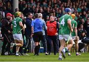 7 June 2025; Cork manager Pat Ryan and Limerick manager John Kiely alongside referee Thomas Walsh after the half-time whistle during the Munster GAA Hurling Senior Championship final match between Limerick and Cork at TUS Gaelic Grounds in Limerick. Photo by Piaras Ó Mídheach/Sportsfile