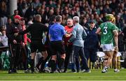 7 June 2025; Cork manager Pat Ryan and Limerick manager John Kiely alongside referee Thomas Walsh after the half-time whistle during the Munster GAA Hurling Senior Championship final match between Limerick and Cork at TUS Gaelic Grounds in Limerick. Photo by Piaras Ó Mídheach/Sportsfile