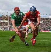 7 June 2025; Diarmuid Healy of Cork in action against Barry Nash of Limerick during the Munster GAA Hurling Senior Championship final match between Limerick and Cork at TUS Gaelic Grounds in Limerick. Photo by John Sheridan/Sportsfile