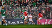 7 June 2025; Shane O'Brien of Limerick, 22, beats Cork goalkeeper Patrick Collins to score his side's 2nd goal, in the 47th minute, during the Munster GAA Hurling Senior Championship final match between Limerick and Cork at TUS Gaelic Grounds in Limerick. Photo by Ray McManus/Sportsfile
