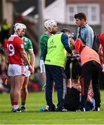 7 June 2025; Referee Thomas Walsh receives medical attention for an injury before being replaced by standy referee James Owens during the Munster GAA Hurling Senior Championship final match between Limerick and Cork at TUS Gaelic Grounds in Limerick. Photo by Piaras Ó Mídheach/Sportsfile