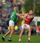 7 June 2025; Shane Barrett of Cork in action against Cathal O'Neill of Limerick during the Munster GAA Hurling Senior Championship final match between Limerick and Cork at TUS Gaelic Grounds in Limerick. Photo by John Sheridan/Sportsfile