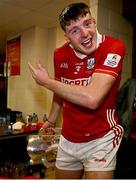 7 June 2025; Eoin Downey of Cork celebrates with the Mick Mackey Cup in the dressing room after his side's victory in the Munster GAA Hurling Senior Championship final match between Limerick and Cork at TUS Gaelic Grounds in Limerick. Photo by Piaras Ó Mídheach/Sportsfile