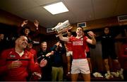 7 June 2025; Cork captain Robert Downey celebrates with the Mick Mackey Cup in the dressing room after his side's victory in the Munster GAA Hurling Senior Championship final match between Limerick and Cork at TUS Gaelic Grounds in Limerick. Photo by Piaras Ó Mídheach/Sportsfile