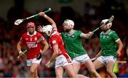 7 June 2025; Tim O'Mahony of Cork is tackled by Cian Lynch, and Aaron Gillane of Limerick, right, during the Munster GAA Hurling Senior Championship final match between Limerick and Cork at TUS Gaelic Grounds in Limerick. Photo by Ray McManus/Sportsfile
