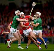 7 June 2025; Tim O'Mahony of Cork is tackled by Cian Lynch, left, and Aaron Gillane of Limerick during the Munster GAA Hurling Senior Championship final match between Limerick and Cork at TUS Gaelic Grounds in Limerick. Photo by Ray McManus/Sportsfile