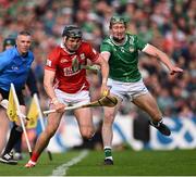 7 June 2025; Darragh Fitzgibbon of Cork is tackled by William O'Donoghue  of Limerick during the Munster GAA Hurling Senior Championship final match between Limerick and Cork at TUS Gaelic Grounds in Limerick. Photo by Ray McManus/Sportsfile
