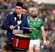 7 June 2025; Limerick captain Cian Lynch leads the players behind the St Patrick's Pipe Band, from Tulla, during the parade before the Munster GAA Hurling Senior Championship final match between Limerick and Cork at TUS Gaelic Grounds in Limerick. Photo by Ray McManus/Sportsfile