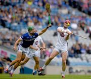 8 June 2025; James Burke of Kildare in action against Jordan Walshe of Laois during the Joe McDonagh Cup final match between Kildare and Laois at Croke Park in Dublin. Photo by John Sheridan/Sportsfile