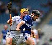 8 June 2025; Aidan Corby of Laois is tackled by Simon Leacy of Kildare during the Joe McDonagh Cup final match between Kildare and Laois at Croke Park in Dublin. Photo by Ray McManus/Sportsfile