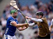 8 June 2025; Kildare goalkeeper Paddy McKenna is tackled by Ben Conroy of Laois during the Joe McDonagh Cup final match between Kildare and Laois at Croke Park in Dublin. Photo by Ray McManus/Sportsfile