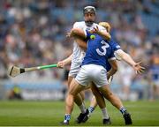 8 June 2025; David Qualter of Kildare is tackled by Laois players, from left, Lee Cleere and Padraig Delaney during the Joe McDonagh Cup final match between Kildare and Laois at Croke Park in Dublin. Photo by John Sheridan/Sportsfile