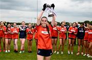 8 June 2025; Armagh captain Gemma Marsden lifts the cup after the LGFA All-Ireland U14 Bronze Final match between Limerick and Armagh at Coralstown/Kinnegad GAA in Westmeath. Photo by Ben McShane/Sportsfile