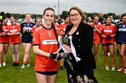 8 June 2025; Armagh captain Gemma Marsden is presented the cup by Trina Murray, LGFA President, after the LGFA All-Ireland U14 Bronze Final match between Limerick and Armagh at Coralstown/Kinnegad GAA in Westmeath. Photo by Ben McShane/Sportsfile