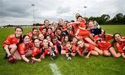 8 June 2025; Armagh players celebrate with the cup after their side's victory in the LGFA All-Ireland U14 Bronze Final match between Limerick and Armagh at Coralstown/Kinnegad GAA in Westmeath. Photo by Ben McShane/Sportsfile