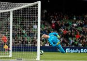 6 June 2025; Republic of Ireland goalkeeper Caoimhin Kelleher makes a save during the international friendly match between Republic of Ireland and Senegal at the Aviva Stadium in Dublin. Photo by Michael P Ryan/Sportsfile