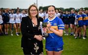 8 June 2025; Tipperary captain Farrah Madigan is presented the cup by Trina Murray, LGFA President, after the LGFA All-Ireland U14 Silver Final match between Tipperary and Cavan at Coralstown/Kinnegad GAA in Westmeath. Photo by Ben McShane/Sportsfile