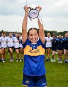 8 June 2025; Tipperary captain Farrah Madigan lifts the cup after the LGFA All-Ireland U14 Silver Final match between Tipperary and Cavan at Coralstown/Kinnegad GAA in Westmeath. Photo by Ben McShane/Sportsfile