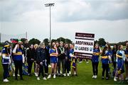 8 June 2025; Tipperary supporters celebrate their side's victory in the LGFA All-Ireland U14 Silver Final match between Tipperary and Cavan at Coralstown/Kinnegad GAA in Westmeath. Photo by Ben McShane/Sportsfile
