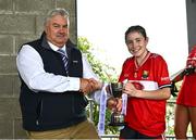 8 June 2025; Cork captain Aoife Harte receives the trophy from LGFA Vice-President, Robbie Smyth, after the 2025 All-Ireland Ladies U14 Platinum Final between Cork and Galway, at Nenagh Éire Óg GAA Club, Nenagh, Co. Tipperary. Photo by Tyler Miller/Sportsfile