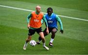 9 June 2025; Will Smallbone and Festy Ebosele, right, during a Republic of Ireland training session at the Stade de Luxembourg in Luxembourg. Photo by Stephen McCarthy/Sportsfile