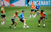 9 June 2025; Jason Knight is tackled by John Joe Patrick Finn, left, and Bosun Lawal, right, during a Republic of Ireland training session at the Stade de Luxembourg in Luxembourg. Photo by Stephen McCarthy/Sportsfile